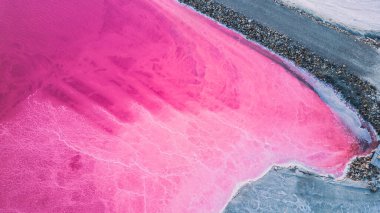 Aerial view of pink salt lake. Salt production plants evaporated brine pond in a salt lake. Salin de Giraud saltworks in the Camargue in Provence, South of France clipart