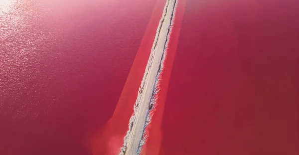 stock image Aerial view of pink salt lake. Salt production plants evaporated brine pond in a salt lake. Salin de Giraud saltworks in the Camargue in Provence, South of France