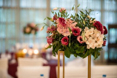 Wedding flowers set up in a restaurant. A wedding colorful bouquet. High quality photo