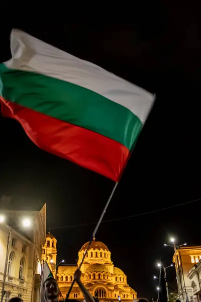 stock image Sofia, Bulgaria - 22 September 2020 : Demonstrators waving the Bulgarian flag during the 76-th day of anti-government protests against corrupt politicians. High quality photo