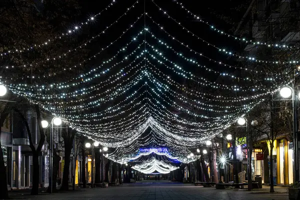 stock image December 2020: Colourful lights in Burgas' city centre. Lights and decorations for Christmas holidays. High quality photo