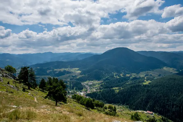 Stock image A beautiful nature landscape of the Bulgarian mountains. Below can be seen the little village of Yagodina. High quality photo