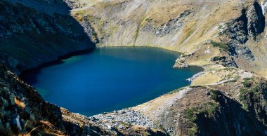 One of the lakes of Rila mountain in Bulgaria. High quality photo of a lake clipart