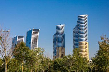 Modern Architecture: Skyscrapers against a Clear Blue Sky clipart