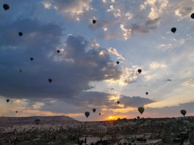 Stunning Hot Air Balloons at Sunrise Over Cappadocia Landscape clipart