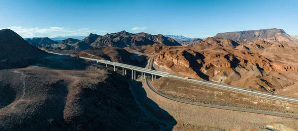 Aerial view of highway in California, United States. Scenic landscape, road, desert. Driving truck, car. Traveling. View from above, drone shot.