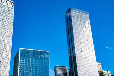 Canary Wharf, Londra 'daki şirket binaları. Londra, İngiltere 'deki gökdelenlerin yakın görüntüsü.