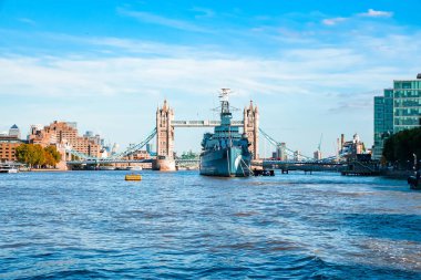 Tower Bridge and HMS Belfast on a summer day in London, England clipart