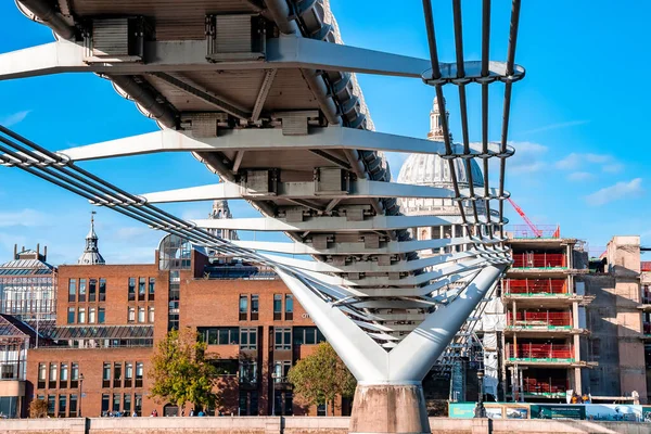 stock image Millennium Bridge and St. Pauls Cathedral in London. View from the river Thames.