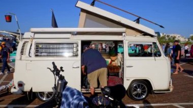 Vintage classic VW van motorhome displayed at classic car exhibition on Santa Monica wooden pier on a sunny day
