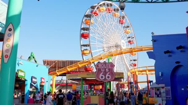 Ferris Wheel Roller Coaster Rides People Exploring Shops Pacific Amusement — Stockvideo