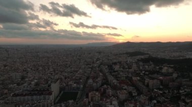 Aerial view of residence districts in European city of Barcelona. Sunset over beautiful Barcelona city.