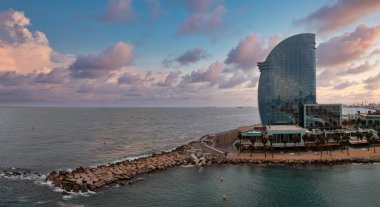 Panoramic aerial view of famous Barceloneta beach with hotel luxury W Barcelona. Birds eye of Barcelona, Catalunya, Spain.