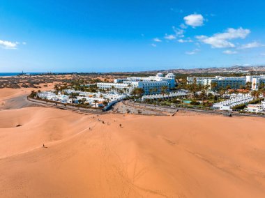 Panoramic aerial scene of the Maspalomas Dunes in Playa del Ingles, Maspalomas, Gran Canaria, Spain. Endless desert sands. Magical safari dunes.