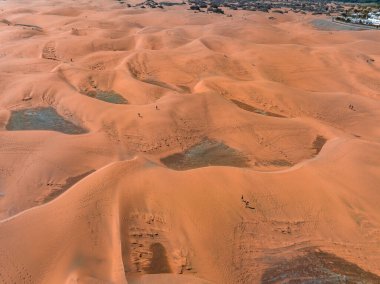Panoramic aerial scene of the Maspalomas Dunes in Playa del Ingles, Maspalomas, Gran Canaria, Spain. Endless desert sands. Magical safari dunes.