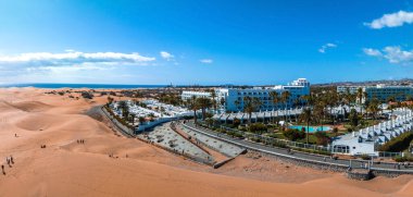 Hotel Riu Palace from above. Luxury grand accommodation with beautiful scenery of the famous desert dunes.