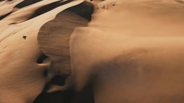 Panoramic aerial scene of the Maspalomas Dunes in Playa del Ingles, Maspalomas, Gran Canaria, Spain. Endless desert sands. Magical safari dunes.