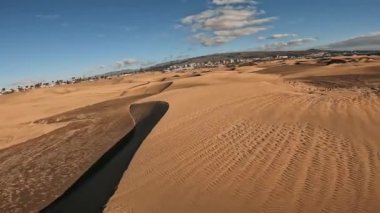 Panoramic aerial scene of the Maspalomas Dunes in Playa del Ingles, Maspalomas, Gran Canaria, Spain. Endless desert sands. Magical safari dunes.
