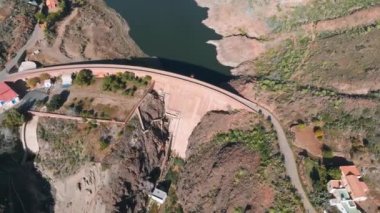 Artificial lake water dam in the Canary Islands at Gran Canaria. Aerial view of the Dam holding the water.
