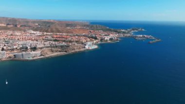 Beautiful aerial view of the island of Gran Canaria. Magical cliffs by the Atlantic ocean, small buildings and natural landscape. 