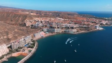 Beautiful aerial landscape with Anfi beach and resort, Gran Canaria, Spain. Luxury hotels, turquoise water, sandy beaches in Spain. Luxury beach vacation concept. Heart shaped island.