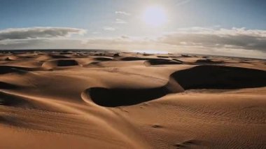 Panoramic aerial scene of the Maspalomas Dunes in Playa del Ingles, Maspalomas, Gran Canaria, Spain. Endless desert sands. Magical safari dunes.