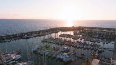 Puerto de Mogan fishing town aerial view at sunset. Traditional colorful buildings with many fishing boats at Gran Canaria, Canary Islands, Spain