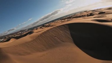 Panoramic aerial scene of the Maspalomas Dunes in Playa del Ingles, Maspalomas, Gran Canaria, Spain. Endless desert sands. Magical safari dunes.