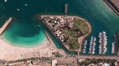Beautiful aerial landscape with Anfi beach and resort, Gran Canaria, Spain. Luxury hotels, turquoise water, sandy beaches in Spain. Luxury beach vacation concept. Heart shaped island.