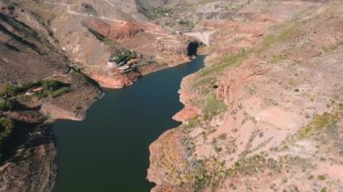 Artificial lake water dam in the Canary Islands at Gran Canaria. Aerial view of the Dam holding the water.