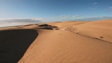 Panoramic aerial scene of the Maspalomas Dunes in Playa del Ingles, Maspalomas, Gran Canaria, Spain. Endless desert sands. Magical safari dunes.