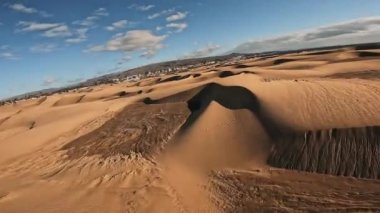 Panoramic aerial scene of the Maspalomas Dunes in Playa del Ingles, Maspalomas, Gran Canaria, Spain. Endless desert sands. Magical safari dunes.