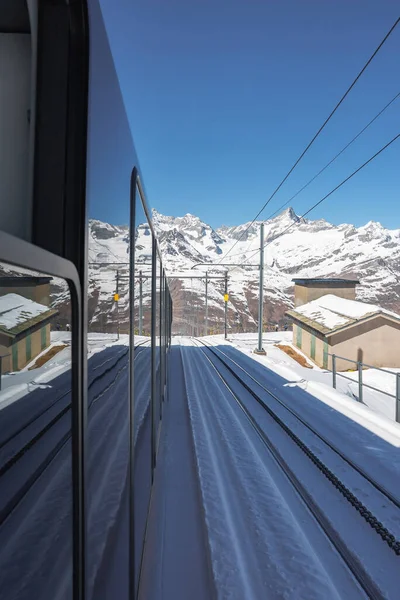 stock image The train of Gonergratbahn running to the Gornergrat station and Stellarium Observatory - famous touristic place with clear view to Matterhorn. Glacier Express train.