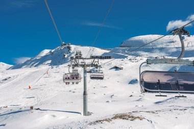 Beautiful view of Gornergrat, Zermatt, Matterhorn ski resort in Switzerland with cable chair lift transportation. Ski lifts in Switzerland. Winter holidays. clipart