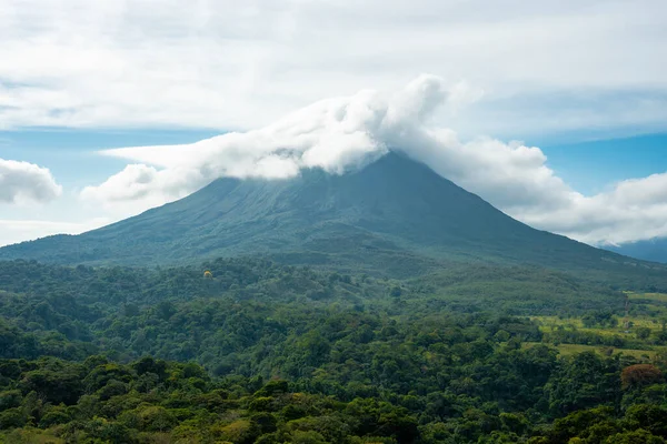 stock image Amazing view of beautiful nature of Costa Rica with cloudy volcano Arenal background. Panorama of volcano Arenal reflected on wonderful picturesque lake, La Fortuna, Costa Rica. Central America.