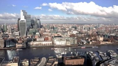 Aerial view of the City of London Shard. High quality 4k footage. Aerial view of London with The Shard skyscraper and Thames river at sunset with grey clouds in the sky