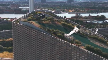 Amager Bakke, Amager Hill or Amager Slope or Copenhill - a heat and power waste-to-energy plant and a sports park in Amager, Copenhagen, Denmark. ESG green energy.