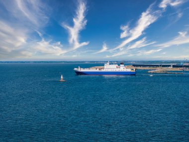 Industrial ship crossing the canal moving towards Malmo bridge between Sweden and Denmark.