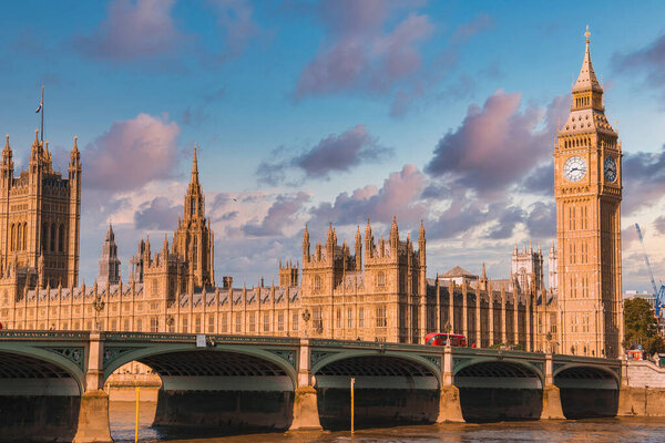 Big Ben, Westminster Bridge on River Thames in London, the UK. English symbol. Lovely puffy clouds, sunny day