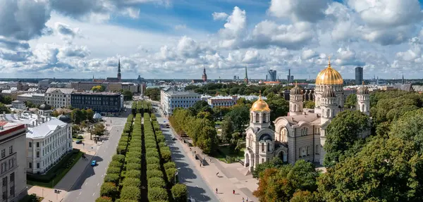 stock image The Nativity of Christ Cathedral in Riga, Latvia. Byzantine-styled Orthodox cathedral, the largest in the Baltic region, with golden colored dome, polished gilded cupolas gleaming through the trees