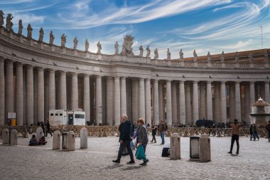 Explore the scenic St. Peters Square, Vatican City. A couple strolls on cobblestones, columns tower above, and tourists capture the historic charm and practical amenities. clipart