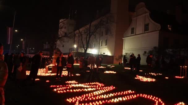 Gathering Riga Red Candle Holders Illuminating Scene Signifies Respectful Commemoration — Stock Video