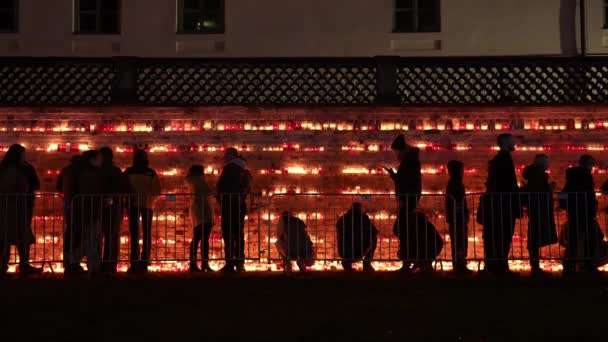 Gathering Riga Red Candle Holders Illuminating Scene Signifies Respectful Commemoration — Stock Video