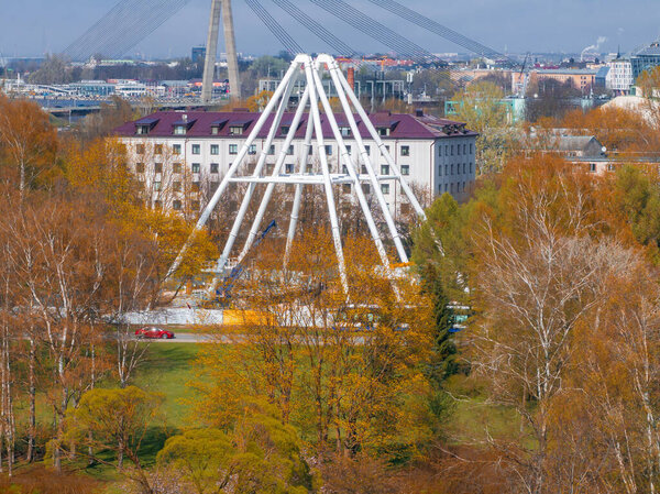 Construction of the observation wheel in Riga, Latvia. Beautiful ferris wheel in the Victory park in the center of Riga with a beautiful view of the old town.
