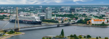 Aerial view of the large cruise ship docked in Riga port, Latvia near the old town and city center.