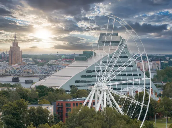 stock image Construction of the observation wheel in Riga, Latvia. Beautiful ferris wheel in the Victory park in the center of Riga with a beautiful view of the old town.