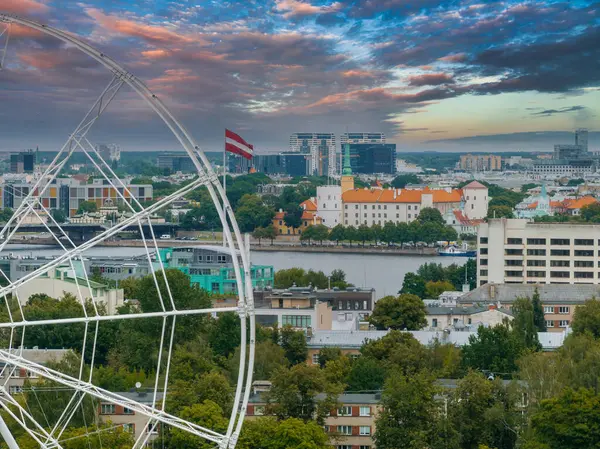 stock image Construction of the observation wheel in Riga, Latvia. Beautiful ferris wheel in the Victory park in the center of Riga with a beautiful view of the old town.