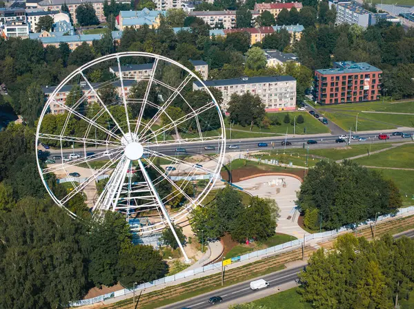 stock image Construction of the observation wheel in Riga, Latvia. Beautiful ferris wheel in the Victory park in the center of Riga with a beautiful view of the old town.