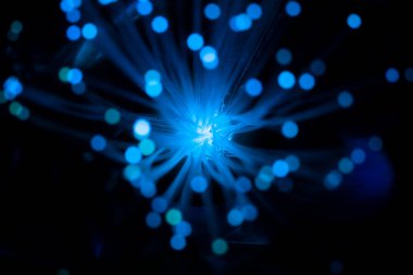 Parlayan parçacıklarla soyut arkaplan