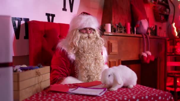 Happy Santa Claus His White Rabbit Sitting Table His Residence — Stockvideo